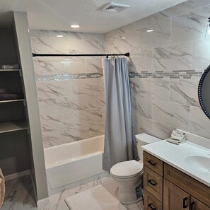 Hair dryer, towels, soap, toilet paper