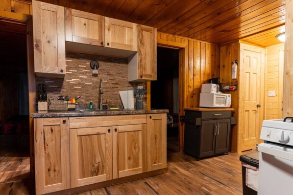 Fridge, microwave, oven, stovetop - Hillside Resort Cabin #1 (Phelps)