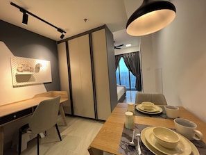 Family Studio Suite, Balcony, City View | In-room dining