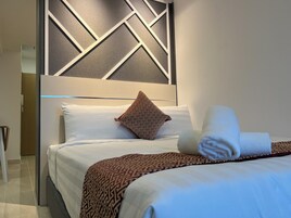 Family Studio Suite, Balcony, City View | Desk, laptop workspace, blackout drapes, iron/ironing board