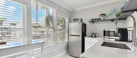 Fridge, microwave, stovetop, coffee/tea maker