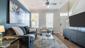 Apartment, 1 Bedroom | Living area | 50-inch TV with digital channels