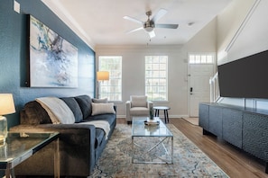 Apartment, 1 Bedroom | Living area | 50-inch TV with digital channels