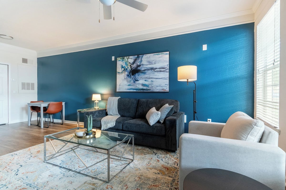 Apartment, 1 Bedroom | Living area | 50-inch TV with digital channels