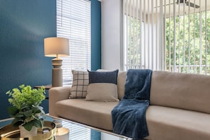 Standard Apartment, 2 Bedrooms | Living area | 50-inch TV with digital channels