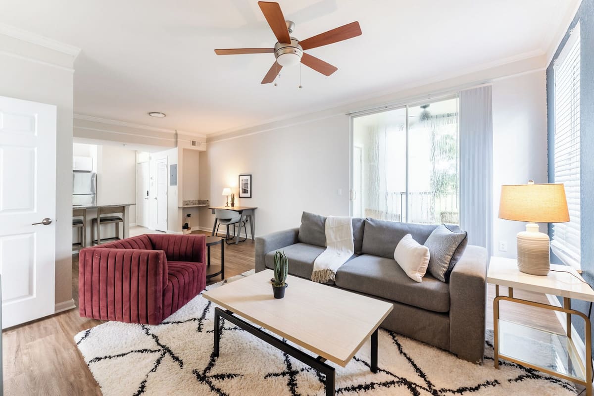 Standard Apartment, 1 Bedroom | Living area | 50-inch TV with digital channels