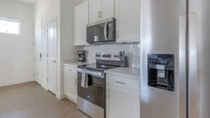 Apartament, 1 dormitori | Cuina privada | Frigorífic gran, microones, forn i placa de cuina