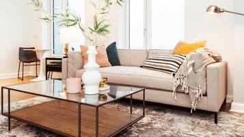 Apartment, 1 Bedroom | Living area | 50-inch TV with digital channels