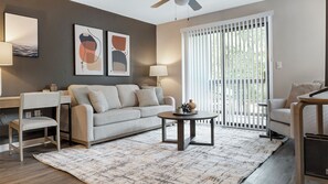 Apartment, 2 Bedrooms | Living area | 50-inch TV with digital channels