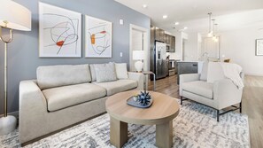 Apartment, 1 Bedroom | Living area | 50-inch TV with digital channels