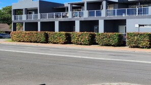 A modern building with multiple balconies and a flat roof. - Jopen Motel Unit 3 ~ Stress-free and comfortable! (Sussex Inlet)
