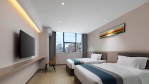 A hotel room with two beds, a TV, a city view, and a painting on the wall. - Days Inn by Wyndham Zhuhai Qinglv Road (Zhuhai)