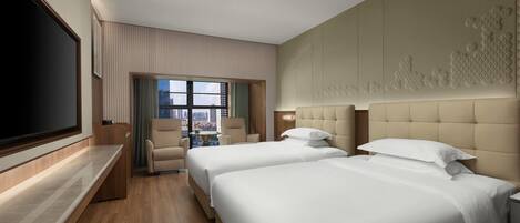 A hotel room with two beds, a large flat-screen TV, a view of the city through a window, and a wooden floor.