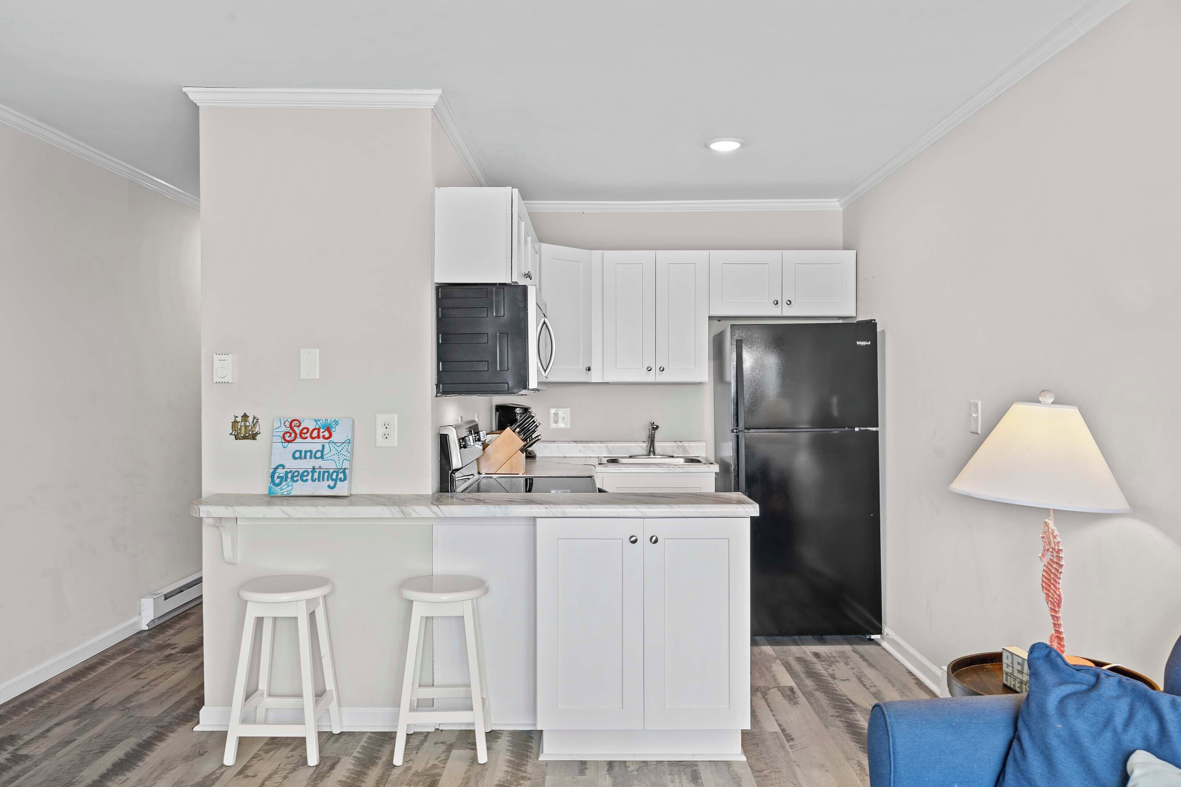 Fridge, microwave, stovetop, coffee/tea maker
