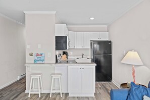 Fridge, microwave, stovetop, coffee/tea maker - Steps to Sand! 3rd-Floor North Topsail Beach Condo (North Topsail Beach)