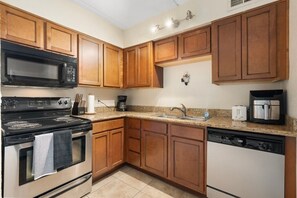 Microwave, oven, stovetop, dishwasher - Cozy 2-bedroom condo with AC in Prime Scottsdale (Scottsdale)