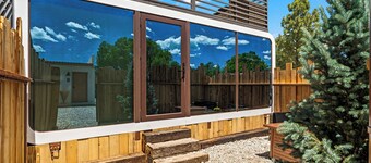 LUXX Space Cabin Tiny House with rooftop deck, private fenced patio.