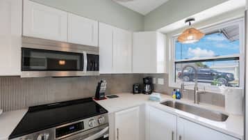 Fridge, stovetop, toaster, cookware/dishes/utensils