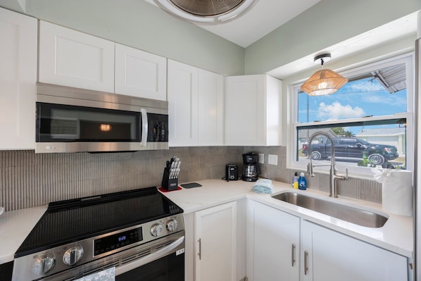 Fridge, stovetop, toaster, cookware/dishes/utensils