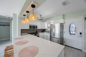 Fridge, stovetop, toaster, cookware/dishes/utensils