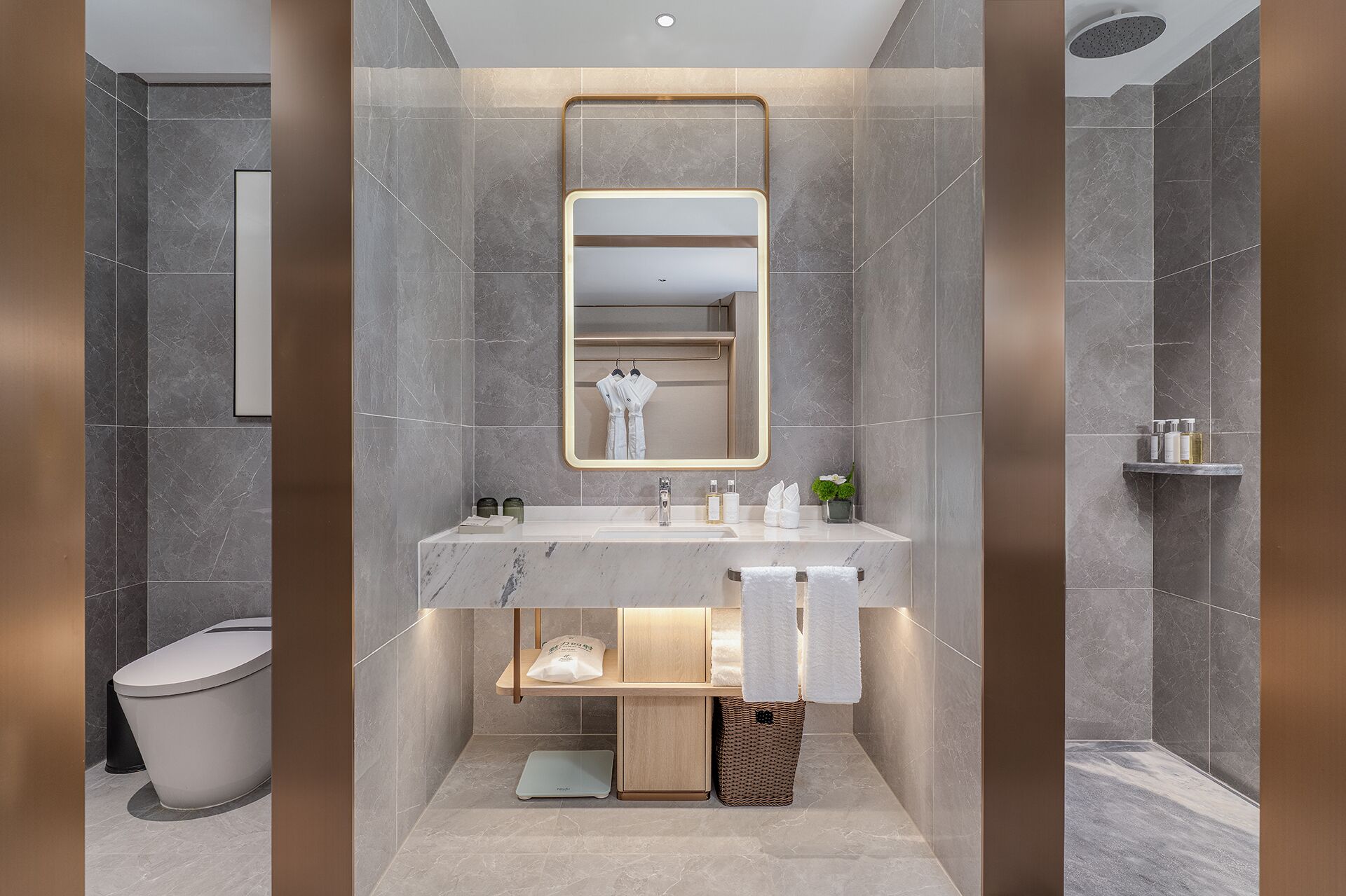 A modern bathroom with a marble sink, a large mirror, and a shower area.