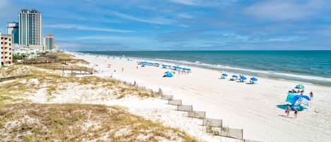 On the beach, sun loungers, beach towels