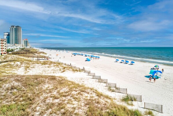On the beach, sun loungers, beach towels