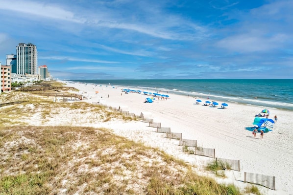 On the beach, sun loungers, beach towels
