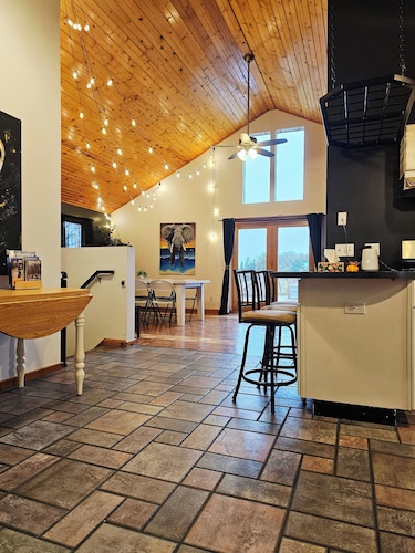 Countryside Knotty Pine 
1King,2Queen,2bunk beds
Large Yard + a deck with a View