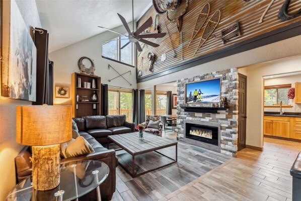 Smart TV, fireplace, books, printers