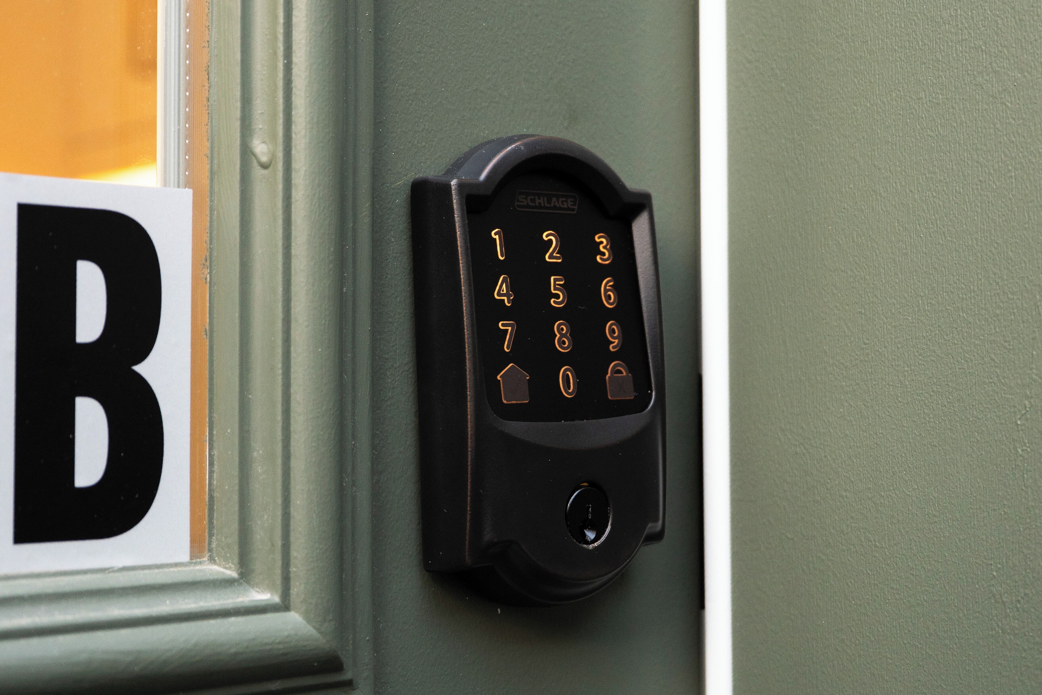 A numeric keypad lock on a door.