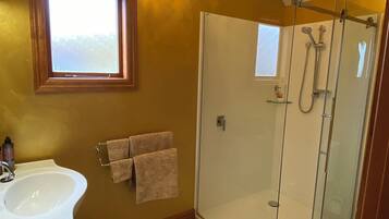 Shower, hair dryer, towels, soap