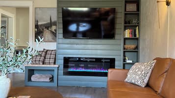 Smart TV, fireplace, books