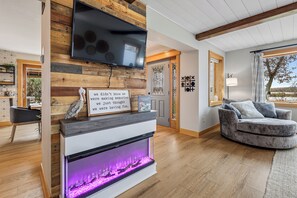 Smart TV, fireplace, table football, books