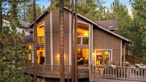 A multi-story wooden cabin with large windows, a deck, and a dining area. - Lakeview Cabin w/ Game Room & Deck Near Ski Slopes & Trails Sleeps 16 Waterview by Avantstay (Big Bear Lake)