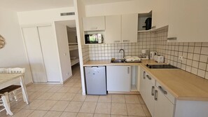 Fridge, microwave, cookware/dishes/utensils