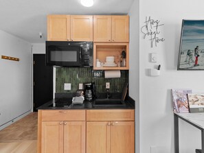 Fridge, microwave, stovetop, coffee/tea maker