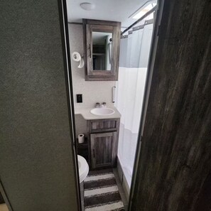 Shower, towels, soap, toilet paper