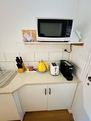 Comfort Apartment, Garden View | Private kitchen | Full-size fridge, microwave, stovetop, cookware/dishes/utensils