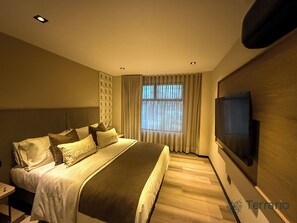 Premium bedding, laptop workspace, soundproofing, iron/ironing board