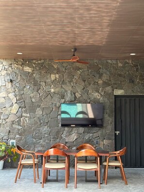 Family Villa | Living area | 55-inch Smart TV with digital channels
