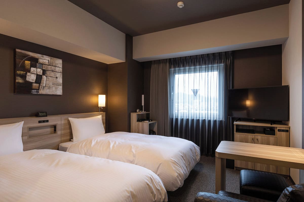 Twin Room, Non Smoking | Desk, laptop workspace, blackout drapes, iron/ironing board