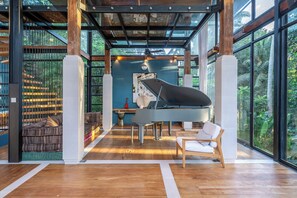 Villa | Living area | 32-inch LED TV with digital channels, books