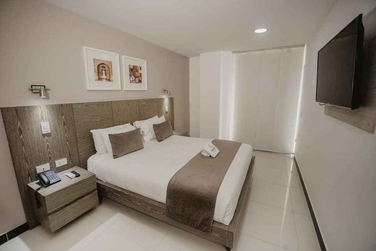 Deluxe Room, Balcony, City View | In-room safe, desk, blackout drapes, free WiFi