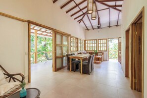 Comfort House, Patio, Garden View | Living area | Flat-screen TV