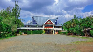 A two-story building with a prominent sign reading "Olepolo's Resort". - Ole Polos Resort Mogotio  (Mogotio)