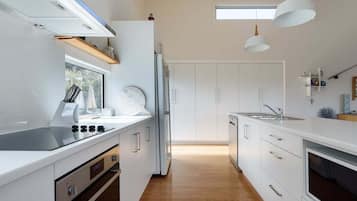 Microwave, stovetop, dishwasher, cookware/dishes/utensils