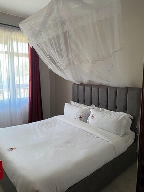 Habitación doble Deluxe, vista a la ciudad | Wifi gratis y ropa de cama