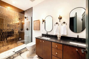 Shower, hair dryer, towels, shampoo