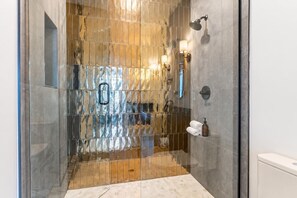 Shower, hair dryer, towels, shampoo